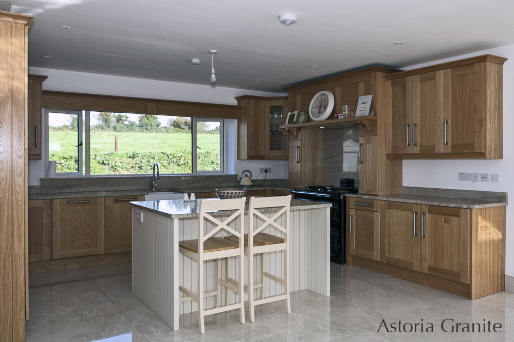 New kitchen with Astoria Granite island, countertops & splashback